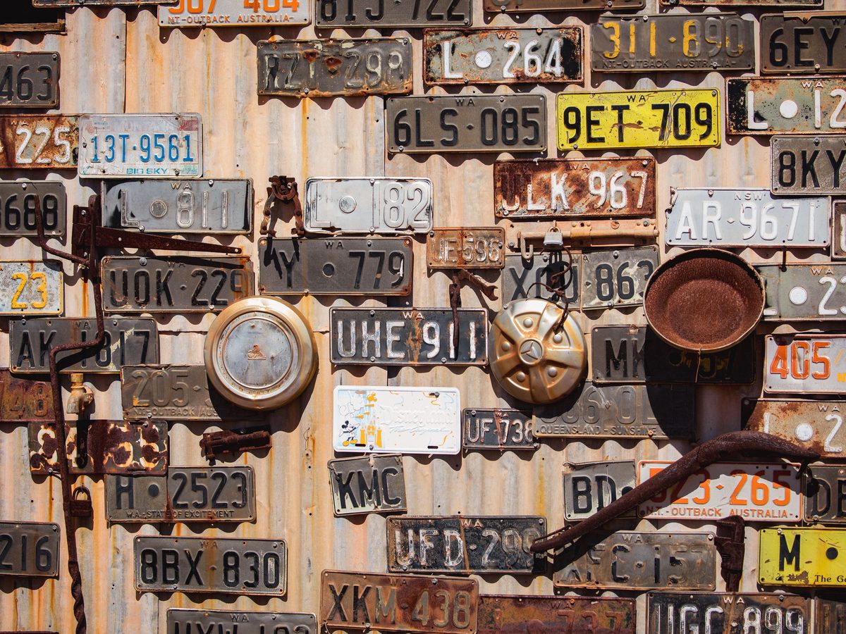 9. Wall of weathered vintage plates. Same idea, no Québec marks.